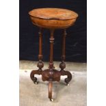 A Victorian Walnut veneered work box on a carved wood stand on castors 77 x 43 x 43 cm