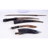 A South East Asian wooden handled dagger with leather coated wooden sheath together with a Kukri and