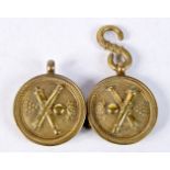 A PAIR OF ANTIQUE BRASS MILITARY BADGES. 4.5 cm wide.