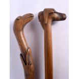 TWO ANTIQUE FOLK ART WALKING CANES. 90 cm long. (2)