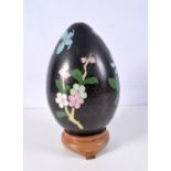 A large Chinese Cloisonne egg on a wooden stand 33 cm.