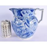 A LARGE EARLY 19TH CENTURY ENGLISH BLUE AND WHITE JUG decorated with building and farm house. 20 cm