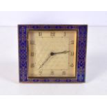 A small Art deco enamelled metal clock 8 x 9 cm.