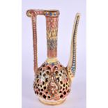A HUNGARIAN FAIENCE RETICULATED ZSOLNAY TYPE EWER. 14 cm high.