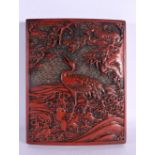 A 19TH CENTURY JAPANESE MEIJI PERIOD RED LACQUER COVER decorated with birds amongst foliage. 24 cm x