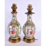 A PAIR OF 19TH CENTURY CHINESE CANTON FAMILLE ROSE COUNTRY HOUSE LAMPS Qing. 23 cm high.