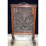 A large wooden fire screen with removable central section 112 x 70cm