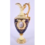Late 19th / early 20th century Coalport ewer with ivory and cobalt blue ground with raised gilding p
