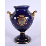 AN EARLY 20TH CENTURY FRENCH TWIN HANDLED BLUE PORCELAIN VASE Sevres style. 12 cm high.