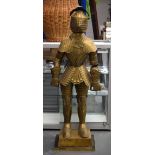 AN UNUSUAL EARLY 20TH CENTURY EUROPEAN BRASS CHILD SIZE SUIT OF ARMOUR. 125 cm high.