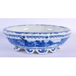A 19TH CENTURY CHINESE BLUE AND WHITE PORCELAIN NARCISSUS BOWL bearing Yongzheng marks to base. 18 c