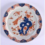 A RARE 18TH CENTURY DELFT IMARI TIN GLAZED ENAMEL PLATE painted with a bird perched amongst flowerin