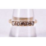 AN 18CT GOLD AND DIAMOND FIVE STONE RING. O. 2.8 grams.