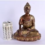 A 19TH CENTURY INDIAN TIBETAN FIGURE OF A BUDDHA modelled upon a lotus capped base. 25 cm x 14 cm.