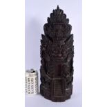 A LARGE EARLY 20TH CENTURY BALINESE CARVED WOOD TEMPLE FIGURE depicting buddhistic deities in variou