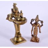 AN 18TH CENTURY INDIAN BRONZE FIGURE OF A BUDDHISTIC DEITY modelled holding an oil burner, together