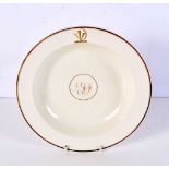 A 19th Century Wedgwood plate with a central monogram and impressed mark 25.5 cm.