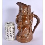 A 19TH CENTURY SALT GLAZED STONEWARE CHARACTER JUG depicting a stoutly male. 26 cm high.