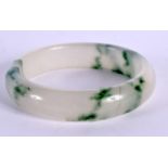 A CHINESE JADE BANGLE 20th Century. 7 cm diameter.