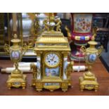 A LARGE 19TH CENTURY FRENCH GILT BRONZE AND PORCELAIN CLOCK GARNITURE. Largest 54 cm x 28 cm. (3)