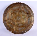 A 19TH CENTURY MIDDLE EASTERN SILVER INLAID DISH decorated with motifs. 25 cm wide.