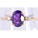 A 14CT GOLD AMETHYST AND DIAMOND RING. 2.7 grams. K.