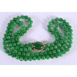 A CHINESE 14CT GOLD AND JADE NECKLACE. 177 grams. 53 cm long.