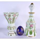 A BOHEMIAN GLASS DECANTER AND STOPPER together with a vase & egg. Largest 31 cm high. (3)