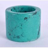 A CHINESE CARVED TURQUOISE ARCHERS RING 20th Century. 4 cm wide.