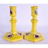 A PAIR OF 19TH CENTURY BERLIN PORCELAIN CANDLESTICKS Meissen style. 14.5 cm high.