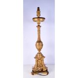 A 18th Century carved gilt wood candlestick 86 cm
