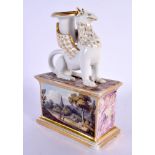 19th century English porcelain candlestick in the form of a griffin seated on a plinth, the plinth h