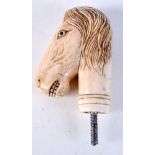 A carved bone walking cane handle in the form of a horse 9cm