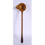 A 19TH CENTURY MIDDLE EASTERN CARVED RHINOCEROS HORN LADLE. 40 cm high.