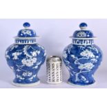 A PAIR OF 19TH CENTURY CHINESE BLUE AND WHITE PORCELAIN VASES AND COVERS Kangxi style. 27 cm x 12 cm