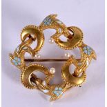 A GOLD AND ENAMEL PEARL BROOCH. 2.7 grams. 2.5 cm wide.
