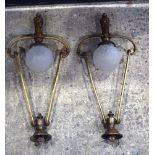 A large pair of large bronze hanging lights with signed Sonover glass shades.