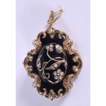 AN ANTIQUE YELLOW METAL ENAMEL MOURNING BROOCH. 26.8 grams. 4.75 cm x 4 cm.