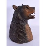 AN EARLY 20TH CENTURY BAVARIAN BLACK FOREST TOBACCO JAR formed as a bear. 27 cm x 12 cm.