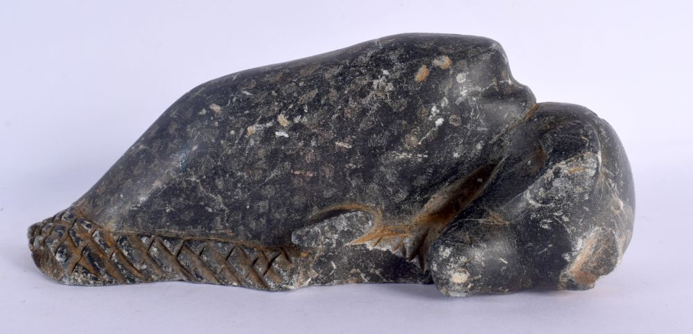 AN UNUSUAL EARLY NORTH AMERICAN INUIT CARVED STONE FIGURE modelled as a whale attacking a sea lion.