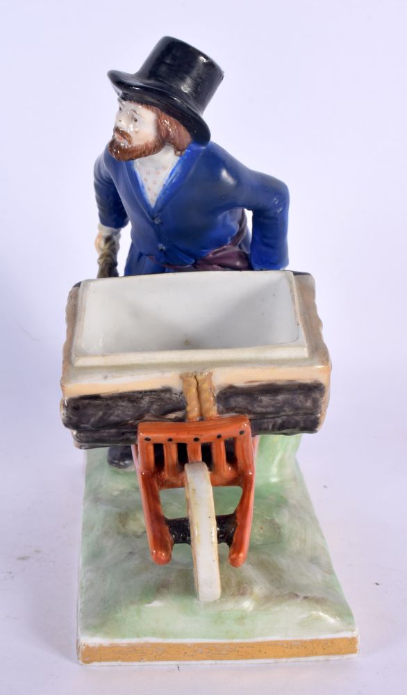 A RARE ANTIQUE RUSSIAN PORCELAIN FIGURE OF A MALE modelled holding a barrow upon a naturalistic base - Image 2 of 5