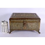 A LARGE 19TH CENTURY INDIAN EMBOSSED COUNTRY HOUSE GILT METAL OVERLAID CASKET decorated with hunting