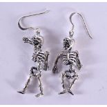 A PAIR OF SILVER SKELETON EARRINGS. 9 grams. 5.25 cm long.