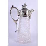 AN ANTIQUE SILVER PLATED CUT AND ENGRAVED GLASS CLARET JUG. 30 cm x 17 cm.