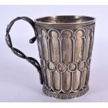 A CONTINENTAL SILVER MUG WITH NEO CLASSICAL DESIGNS. 9.2cm x 10cm x 7cm, weight 141.3g