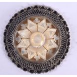 AN EARLY 20TH CENTURY JERUSALEM SILVER AND MOTHER OF PEARL BROOCH. 4.5 cm wide.