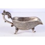 A Chinese embossed white metal sauce pot with Dragon handle 7.5 x 13 cm .