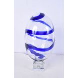 A large Murano glass egg with a blue swirl.25 x 15 cm.