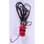 A CORAL SKULL NECKLACE. 3 cm x 2 cm.