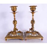 A PAIR OF 19TH CENTURY FRENCH GILT BRONZE AND SEVRES PORCELAIN CANDLESTICKS painted with putti. 20 c